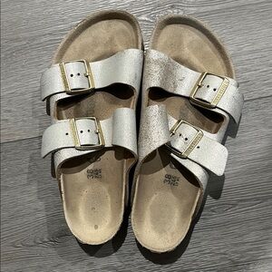 Birkenstock women’s Double-Buckle Sandals in Metallic silver.